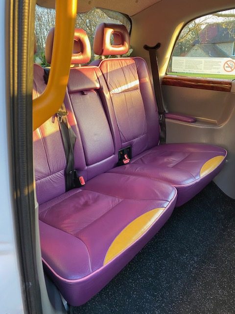 Passenger cabin inside the white TX4 wedding taxi