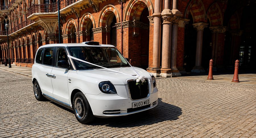 Electric TXE six-seater wedding taxi outside St Pancras