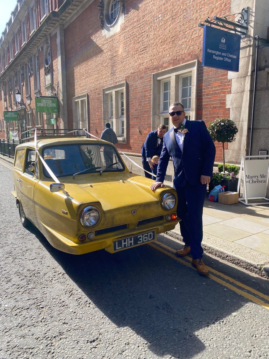 Groom beside the Trotter van outside Kensington and Chelsea Register Office